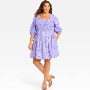Women’s plus sized puff elbow sleeve smocked dress